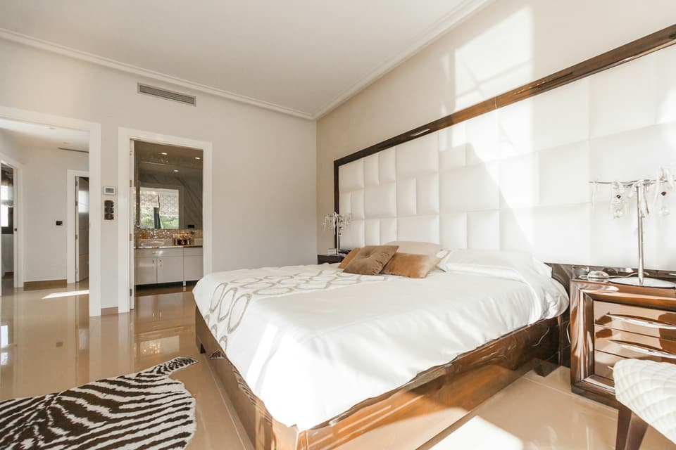 Hotel bedroom with white linen